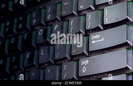 selective focus on enter button of computer keyboard. Stock Photo