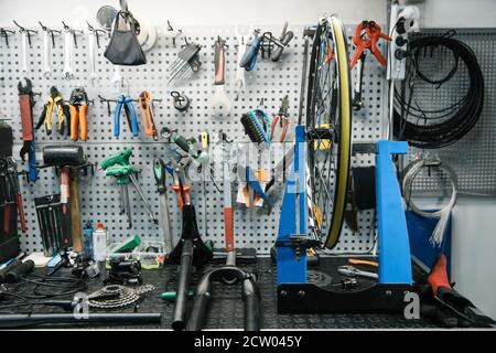 Bicycle workshop interior, tools on the wall Stock Photo