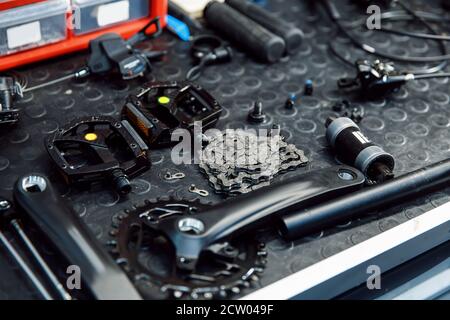 Bicycle workshop, cycle parts on the table closeup Stock Photo