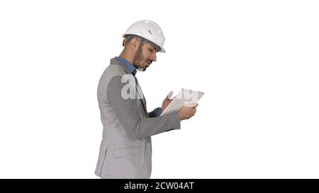 The hipster engineer making video call with tablet showing result of his work on white background. Stock Photo