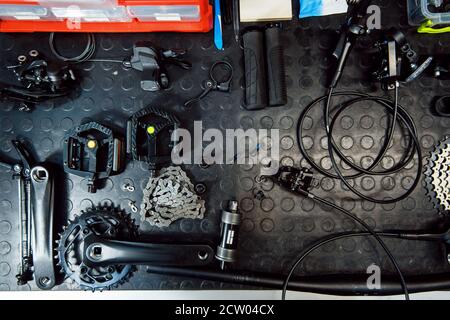 Bicycle workshop, cycle parts on the table closeup Stock Photo