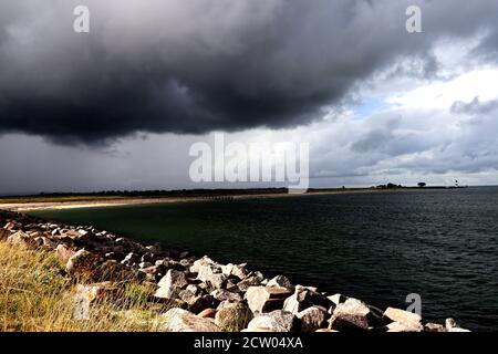 Storm clouds above the sea shore - power in the nature - background Stock Photo