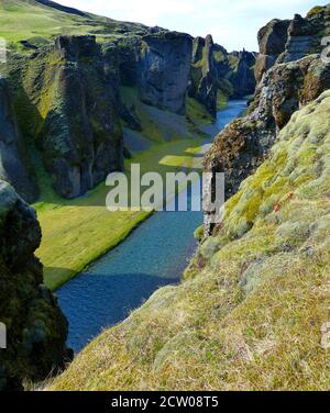 Nature in Iceland. Stunning and magical Fjadrargljufur Canyon. Fjadra River. Natural icelandic landscape. Fairytale like deep gorge with tuff walls. Stock Photo