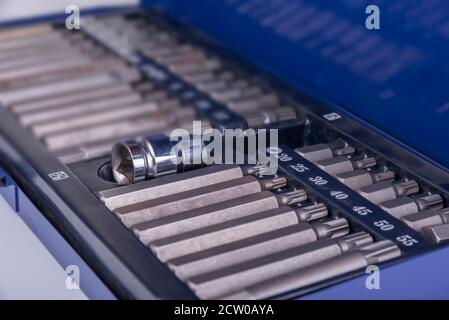 Ratchet with hexagonal and torx bits on a white Stock Photo