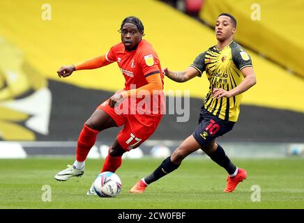 Luton Town's Pelly Ruddock Mpanzu (left) and Watford's Joao Pedro during the Sky Bet Championship match at Vicarage Road, Watford. Stock Photo