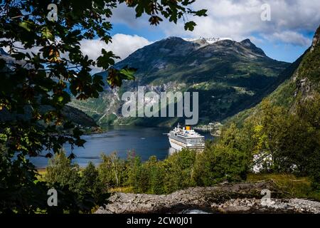 Cruise ship in the port of Geiranger in the famous fjord on a summer day, Norway Stock Photo