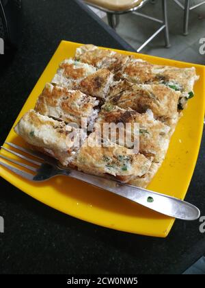 A fast healthy breakfast delicacy masala bread omelette Stock Photo