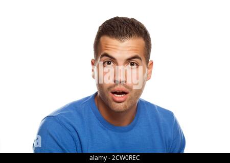 portrait of surprised young man on white background Stock Photo