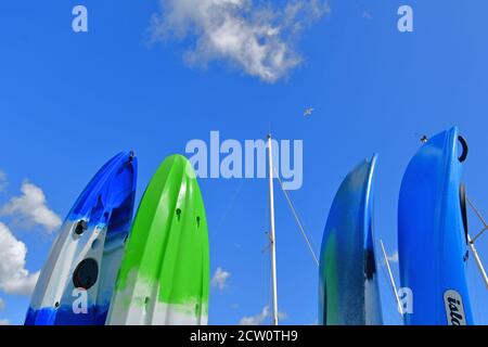 25th September2020. Colourful surf boards standing upright in Lock up against a dramatic cloudy sky of blue. Picture Credit Robert Timoney/Alamy/Stock Stock Photo