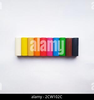 Plasticine sticks of different colors on white background Stock Photo
