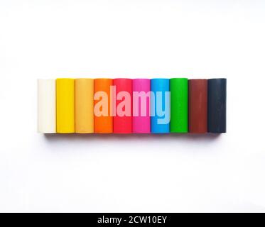 Plasticine sticks of different colors on white background Stock Photo