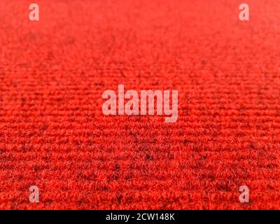 Dark red woolen carpet background with perspective view, selective focus Stock Photo