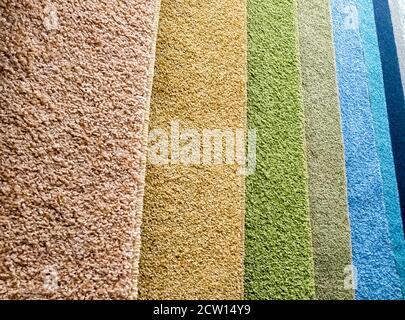 Background from colorful carpet samples in the store Stock Photo