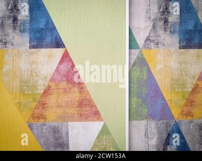 Old colored grunge wallpaper with triangles. Geometric texture Stock Photo