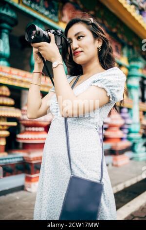 Beautiful local tourist visiting local tourism spot and posing for us. Stock Photo