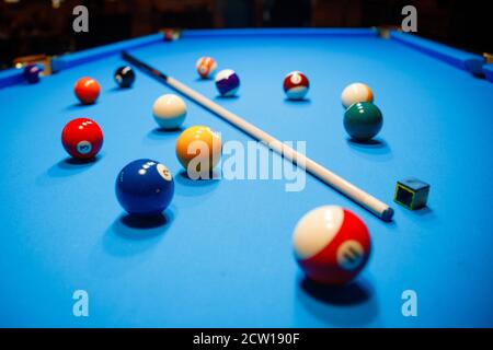 The game of American billiards. Multi-colored billiard balls on gaming table. Stock Photo