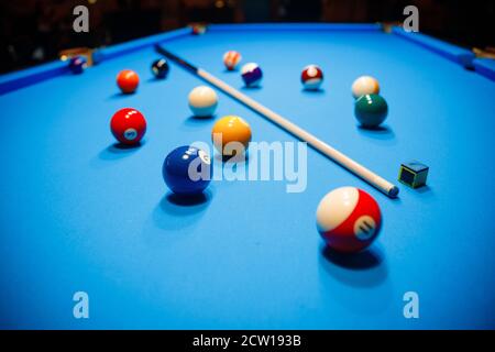 The game of American billiards. Multi-colored billiard balls on gaming table. Stock Photo