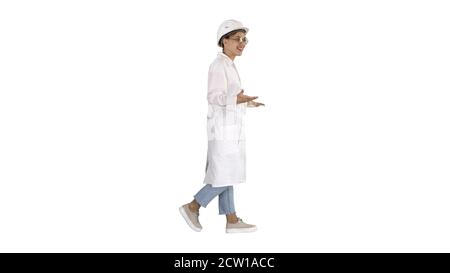 Woman engineer walkin and talking emotionaly on white background Stock Photo