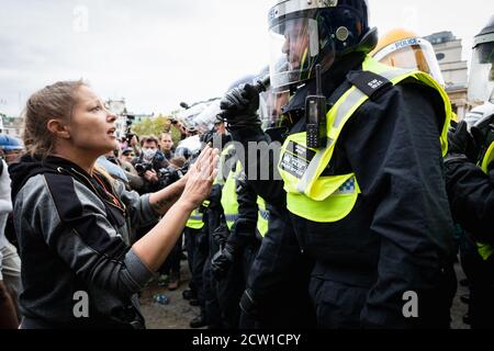 London, UK. 26th Sep, 2020. A women protester tryÕs to talk to the the MET police after they moved in on the Unite for Freedom rally after alleged reports they had broke the risk assignment arranged to carry out the rally. Emergency legislationÊknown as theÊCoronavirus Act 2020Êhas been introduced by the governmentÊto help theÊcountry cope with the demands caused by the coronavirus outbreak. Credit: Andy Barton/Alamy Live News Stock Photo