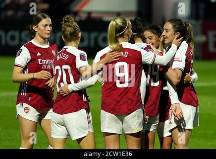 Arsenal's Lisa Evans (right) celebrates scoring her side's fourth goal of the game and hat-trick during the Barclays FA WSL match at Meadow Park, London. Stock Photo