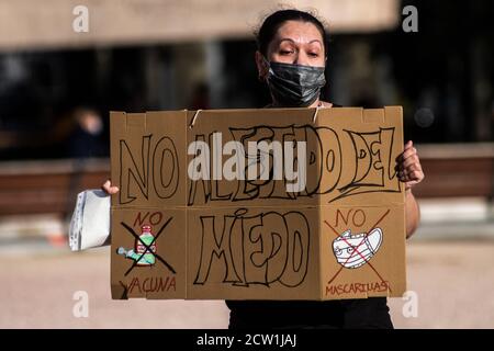 Madrid, Spain. 26th Sep, 2020. A woman holds a placard reading 'no to the state of fear' during a protest of coronavirus sceptics protesting against the use of face masks, vaccines and 5G. Credit: Marcos del Mazo/Alamy Live News Stock Photo