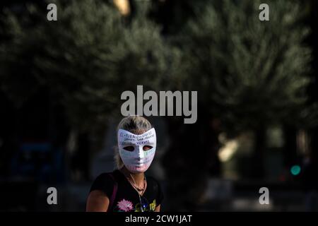 Madrid, Spain. 26th Sep, 2020. A woman wearing a mask during a protest of coronavirus sceptics protesting against the use of face masks, vaccines and 5G. Credit: Marcos del Mazo/Alamy Live News Stock Photo
