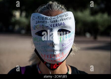 Madrid, Spain. 26th Sep, 2020. A woman wearing a mask during a protest of coronavirus sceptics protesting against the use of face masks, vaccines and 5G. Credit: Marcos del Mazo/Alamy Live News Stock Photo