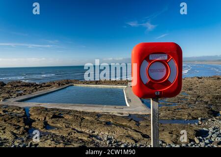 Sea water swimming pool on Westward Ho seafront with life ring Stock Photo