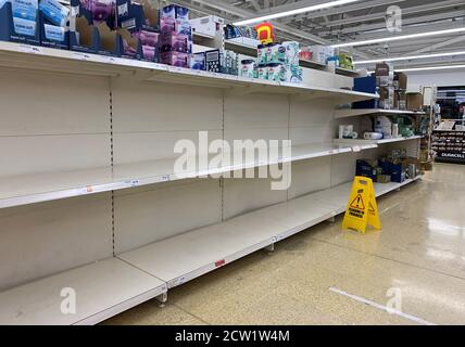 Empty shelves where toilet rolls are usually stocked at a Sainsburys in Wandsworth as people are panic buying as cases of coronavirus are on the rise. Stock Photo