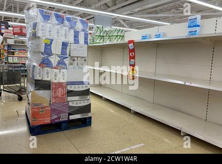 Empty shelves where toilet rolls are usually stocked at a Sainsburys in Wandsworth as people are panic buying as cases of coronavirus are on the rise. Stock Photo