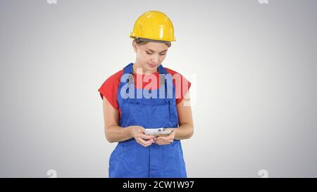 Young cheerful female worker holding salary banknotes in euro on Stock Photo