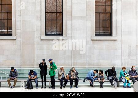 Visitors to the British Museum relax in the Great Court, London, United Kingdom.