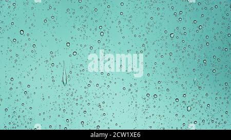 Rain drops running down a car window in a close up view Stock Photo