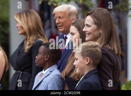 Washington, United States. 26th Sep, 2020. President Donald J. Trump poses with Judge Amy Coney Barrett and her family as he announces her as his Supreme Court Justice Nominee, during a ceremony at the White House in Washington, DC on Saturday, September 26, 2020. Trump is nominating Barrett to replace the seat left by the passing of Justice Ruth Bader Ginsburg, who died last week. Photo by Kevin Dietsch/UPI Credit: UPI/Alamy Live News Stock Photo
