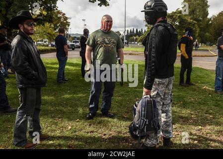 Portland, OREGON, USA. 26th Sep, 2020. The Proud Boys hold a rally in Portland, Oregon, U.S. September 26, 2020. Governor Kate Brown declared a state of emergency prior to Saturdays rally as fears of political violence between Proud Boys and Black Lives Matter protesters grew. Credit: Stephanie Keith/ZUMA Wire/Alamy Live News Stock Photo