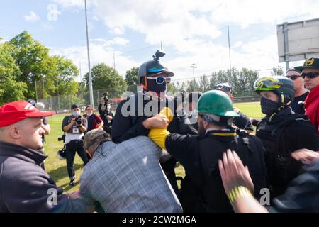 Portland, Oregon, USA. 26th September, 2020. Proud Boys confronting a man during End to Domestic Terrorism Rally in support of Kenosha shooter Kyle Rittenhouse and Aaron 'Jay' Danielson who was shot dead by an antifascist protester during the ongoing Black Lives Matter protests in the city. Credit: Albert Halim/Alamy Live News Stock Photo