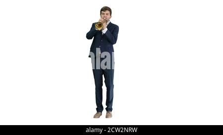 Young man in suit playing a trumpet on white background. Stock Photo