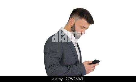 Turk businessman walking and using smartphone on white backgroun Stock Photo