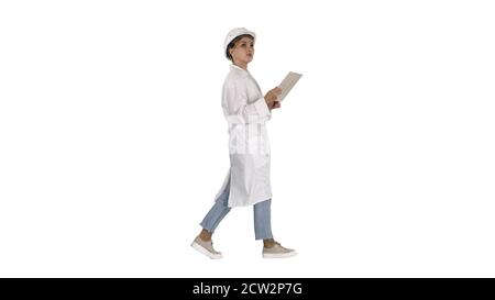 Young technician inspecting and taking necessary notes on digita Stock Photo
