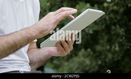 Man touching screen on modern digital tablet pc. Stock Photo