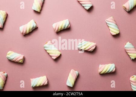 Colorful marshmallow on pink background. flat lay, top view. Delicious snacks pattern background Stock Photo