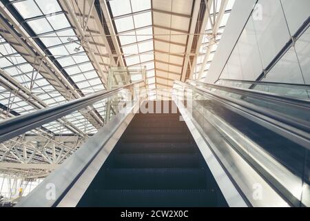 Double Escalator going up. Moving up staircase escalator. floor platform electric escalator. Stock Photo