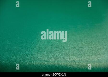 Surface pattern of green synthetic leather textured background, A textured background of soft and modern sofa backrest Stock Photo
