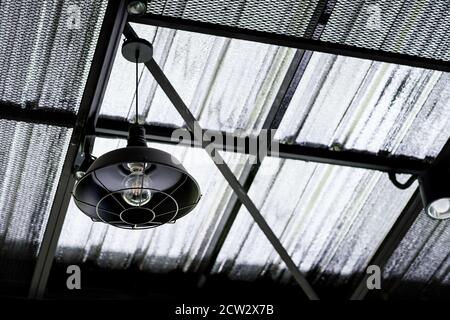 Old Iron Street Lantern, Black lamp for hang on the roof modern in cafe Stock Photo