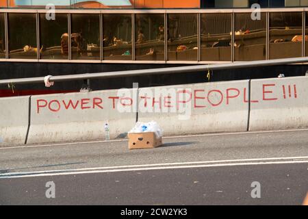 Hong Kong, Hong Kong, China. 30th Sep, 2014. The 2014 Umbrella revolution takes hold with police withdrawing leaving protestors in charge and roads barricaded.Dawn breaks on the 2nd morning after the protests. Slogans on the concrete road divider on Harcourt Road, Admiralty Credit: Jayne Russell/ZUMA Wire/Alamy Live News Stock Photo