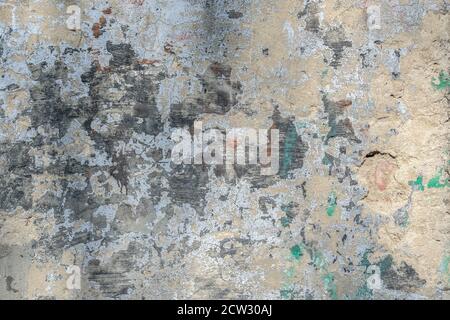 Texture, background of the old wall and with damaged cladding Stock Photo
