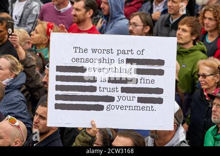 London, UK. - 26 Sept 2020: A placard, critical of government regulations during the coronavirus pandemic, is held aloft at a protest in Trafalgar Square. Stock Photo