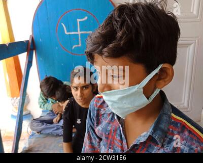 DISTRICT KATNI, INDIA - JULY 08, 2020: indian village childrens group at hindu holy temple, tour and travel with family concept. Stock Photo