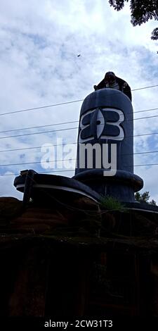 DISTRICT KATNI, INDIA - DECEMBER 15, 2019: Lord shiva giant statue with snake on the top at sky background. Stock Photo