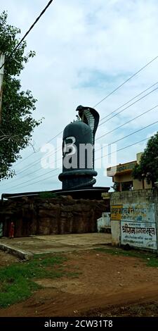 DISTRICT KATNI, INDIA - DECEMBER 15, 2019: Lord shiva giant statue with snake on the top at sky background. Stock Photo